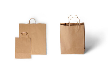 Brown Kraft paper shopping bag mockup isolated on white background.Empty brown paper bag with handles. Realistic kraft package with shadows isolated on white background. design template.3d rendering.
