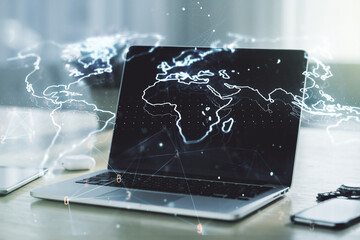 Multi exposure of abstract creative digital world map on laptop background, research and analytics concept