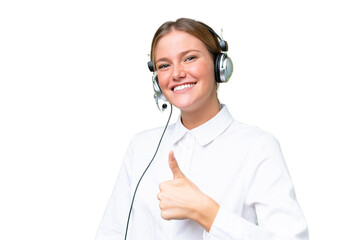 Telemarketer caucasian woman working with a headset over isolated background with thumbs up because...