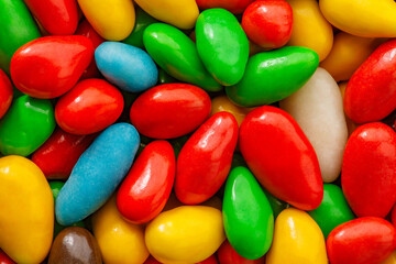 Candy glaze in bulk, red, green, yellow, blue, white, brown, close-up, super macro, mini pieces, wallpaper background