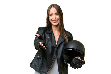Young pretty caucasian woman with a motorcycle helmet over isolated background shaking hands for closing a good deal
