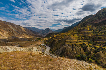 Changeable weather in the Caucasus Mountains. Panoramic view.