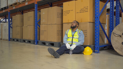 A fired man. Stressed upset depressed worried disappointed worker working in cargo container...