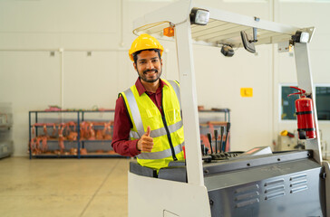 Portrait of middle east worker working in large warehouse store industry.Rack of stock storage....