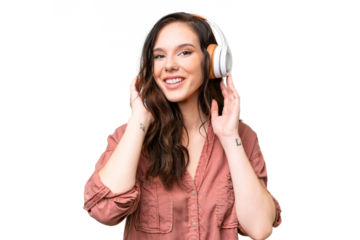 Young caucasian woman over isolated background listening music