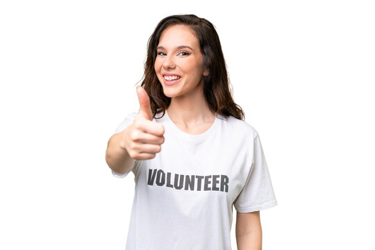 Young volunteer caucasian woman over isolated background with thumbs up because something good has happened