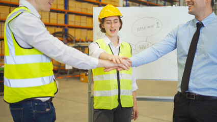 Teamwork of workers working in large warehouse retail store industry.Rack of stock storage....