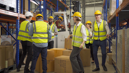 Teamwork group of multi ethnic workers working in large warehouse retail store industry factory. Stock storage. Cargo in ecommerce and logistic concept. Depot. People lifestyle. Shipment service.