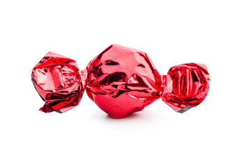 Sweet candy wrapped in foil isolated on white background.
