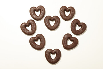 Concept of tasty bakery, gingerbread cookies in chocolate, top view