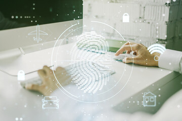 Multi exposure of abstract fingerprint scan interface with hands typing on computer keyboard on background, digital access concept