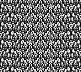 Floral pattern. Vintage wallpaper in the Baroque style. Seamless vector background. White and black ornament for fabric, wallpaper, packaging. Ornate Damask flower ornament