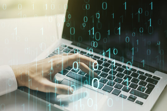 Creative abstract binary code hologram and hands typing on computer keyboard on background, AI and machine learning concept. Multiexposure