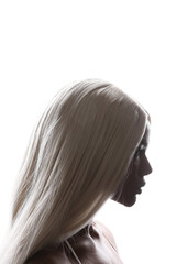 Profile portrait of African American woman with long blonde hair. Beauty hair.