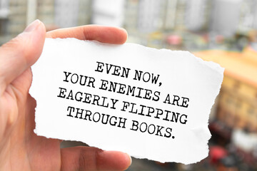 Motivational quote. Even now, your enemies are eagerly flipping through books.