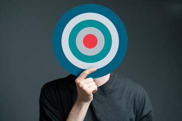 person holding target in front of head, internet sales targeting concept