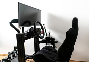 sim racing cockpit, auto simulator seat, playing video games - obrazy, fototapety, plakaty