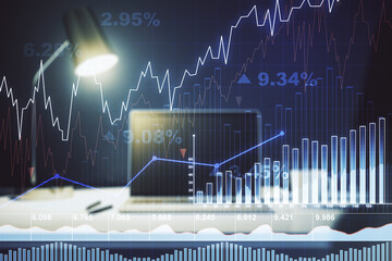 Double exposure of abstract creative financial chart on modern laptop background, research and strategy concept