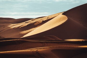 Fototapeta na wymiar A view of desert dunes in the Sahara desert, Morocco