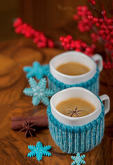 Fototapeta na wymiar coffee with cardamom. winter drink. Coffee in cups with cardamom and white sugar on vintage wooden background