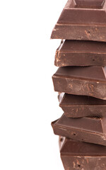 chocolate pieces. dark chocolate bars stacked high