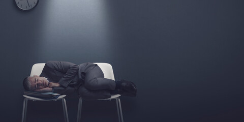 Exhausted job applicant sleeping in the waiting room