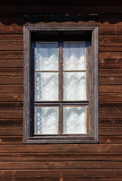 windows on the wooden facade in bulgaria. architectural retro elemet background