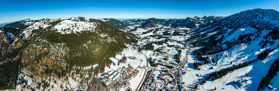 Germany, Bavaria, Oberjoch, Aerial panorama of snow-covered village in Allgau Alps