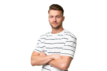 Young blonde caucasian man over isolated background with arms crossed and looking forward