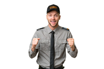 Young security caucasian man over isolated background celebrating a victory in winner position