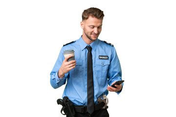 Young police man over isolated background holding coffee to take away and a mobile