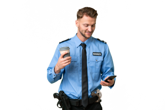 Young police man over isolated background holding coffee to take away and a mobile