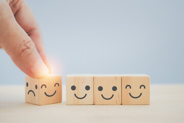 for mental health, service mind concept, hand change bad temper face to good mood icon on wooden...