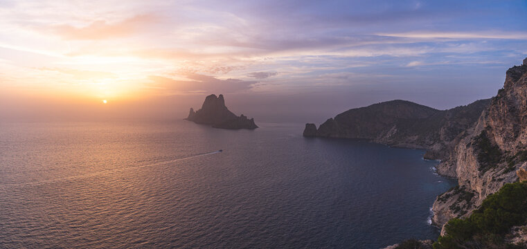 Spain, Balearic Islands, Panoramic view of EsVedraisland seen from clifftop at sunset