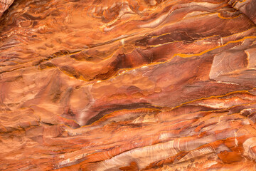 Sandstone rock and mineral layers in Petra, Jordan