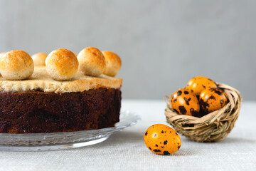 Easter cake simnel for breakfast on a grey background.