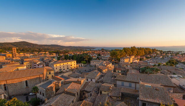 Italy, Lazio, Bolsena, Panoramic view of town at dusk