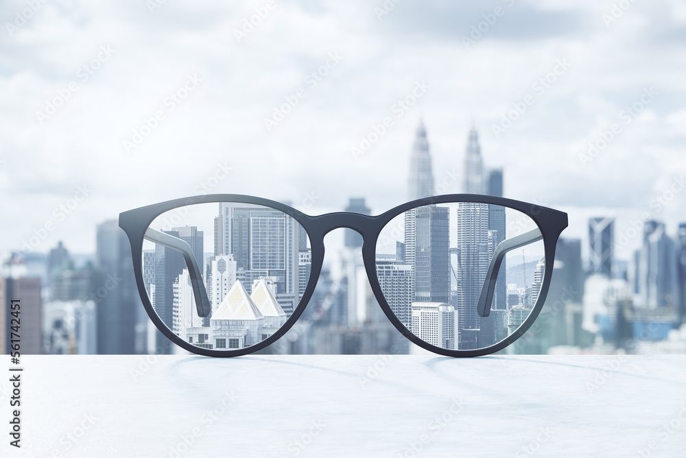 Poster Look through eyeglasses at blurred city with mock up place on sky background. Vision and perspective concept. 3D Rendering.