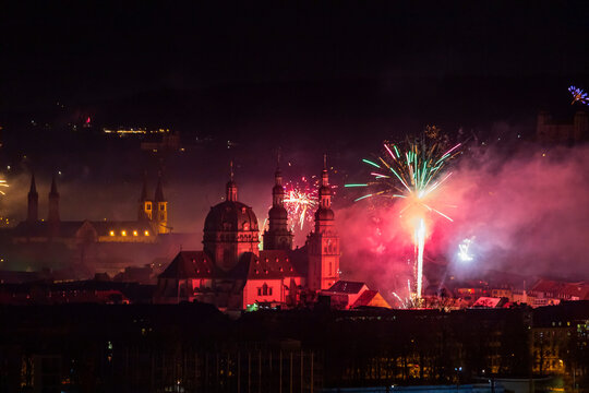 Germany, Bavaria, Wurzburg, New Years Eve fireworks exploding overHaug Monastery