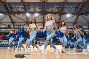 Obraz na płótnie Canvas Full shot of cheerleaders dancing in a gymnasium. Sport concept. High quality photo