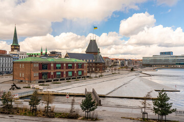 Denmark, Aarhus, Clouds over Aarhus Docklands with Aarhus Custom House in background