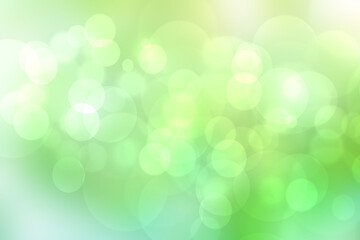 Obraz premium Abstract gradient light blue turquoise yellow green shiny blurred background texture with circular bokeh lights. Beautiful fresh backdrop. Space for design.
