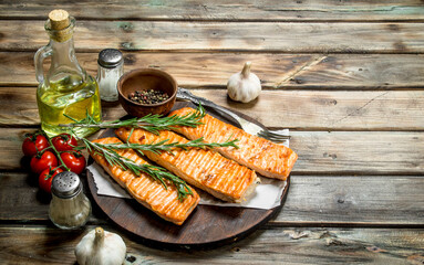 Grilled salmon fillet with spices and rosemary.