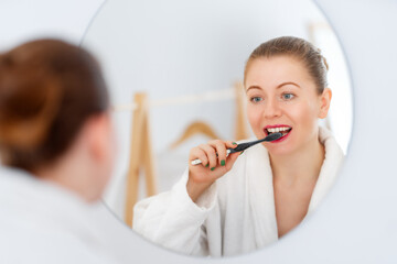 woman brushing  teeth