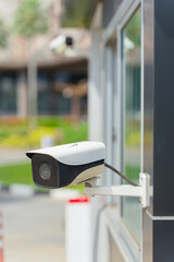 Outdoor CCTV camera, circuit camera security system on the wall building.