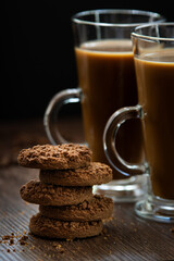 two coffees with milk tea and chocolate chip cookies