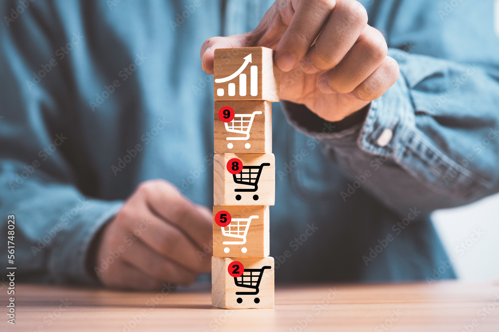 Poster businessman stacking increasing graph on shopping cart trolley which print screen on wooden block cu