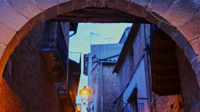 Entrance arch in a medieval village at night. "Arnes" in the province of Tarragona, Spain