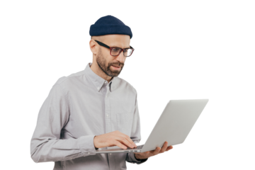 Professional IT developer downloads files, chats online in social networks, bloggs and surfes internet webpages wears formal shirt, stands against grey background. Technology and people concept