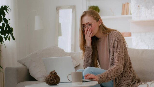 Caucasian shocked girl in glasses feel shock reading bad news woman lost with laptop worry about loosing online with computer terrible information mail Internet app problem business failure at home